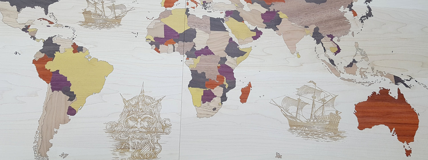 Wilson Custom Works customized hardwood inlay for yacht table featuring wooden nautical world map design